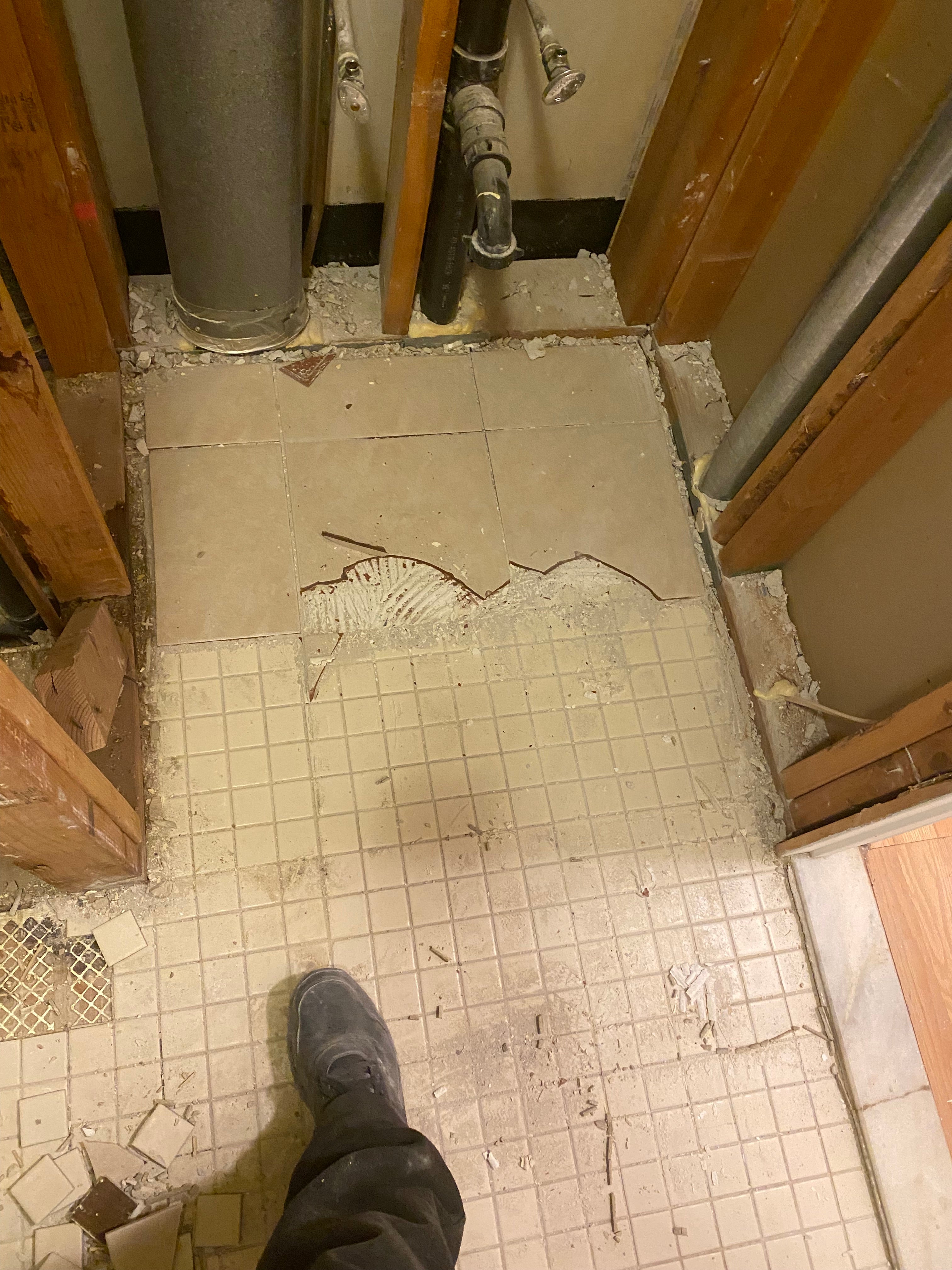 Underfloor heating system installation in a room with tiled floor