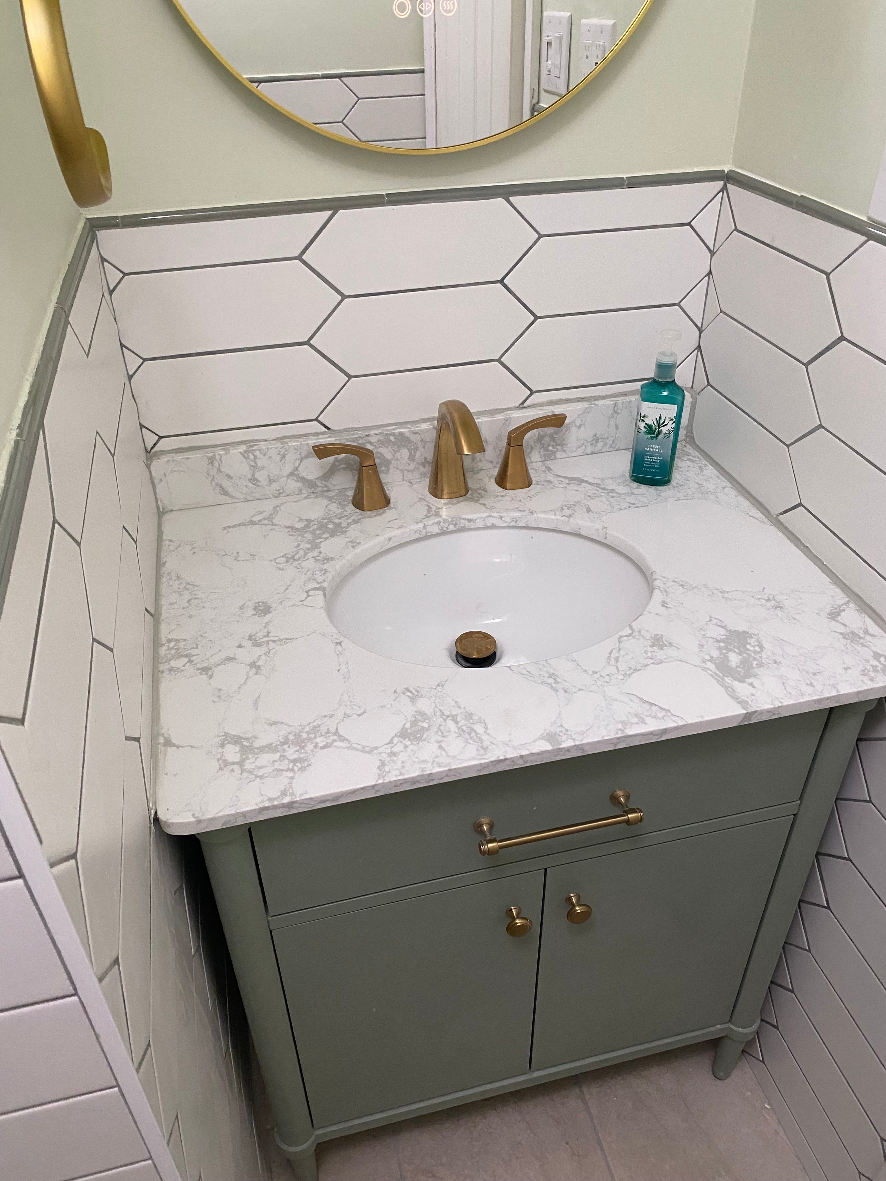 finished bathroom vanity and faucet installed 